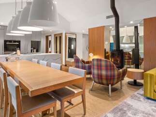 Experience modern luxury in this stunning property, featuring a spacious open-plan living area.