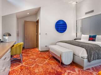 Experience luxury in this stylish hotel room.