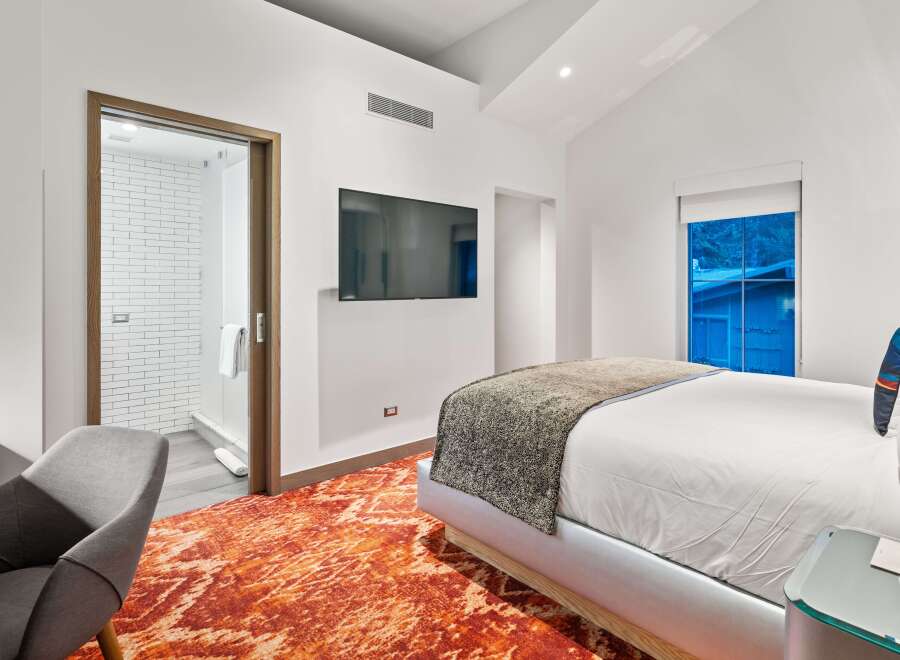 Experience luxury in this stunning bedroom featuring a modern design.