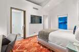 Experience luxury in this stunning bedroom featuring a modern design.