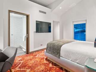 Experience luxury in this stunning bedroom featuring a modern design.