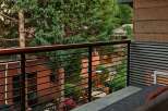 Enjoy the serene views from this stunning balcony, surrounded by lush greenery and a tranquil atmosphere.