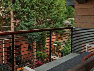 Enjoy the serene views from this stunning balcony, surrounded by lush greenery and a tranquil atmosphere.