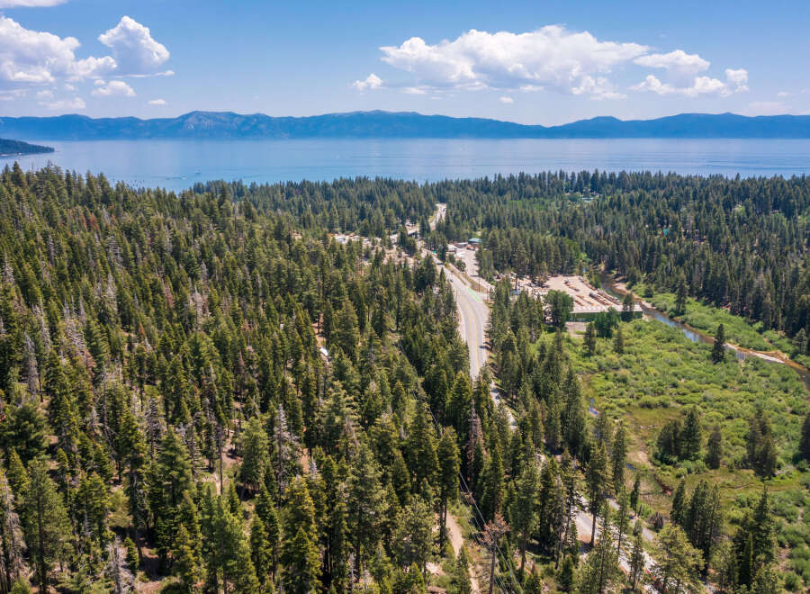 Nestled in a lush forest with stunning lake views, this property offers the perfect blend of serenity and convenience.