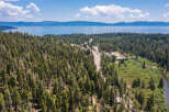 Nestled in a lush forest with stunning lake views, this property offers the perfect blend of serenity and convenience.