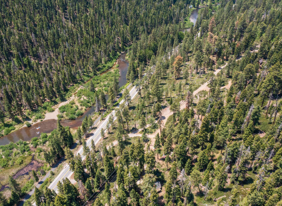 This secluded mountain property boasts stunning views and direct access to a pristine river.