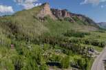 Nestled in the Colorado Rockies, this stunning property boasts breathtaking mountain views and a tranquil setting.