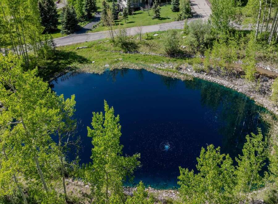 Discover tranquility at this secluded property boasting a stunning private pond.