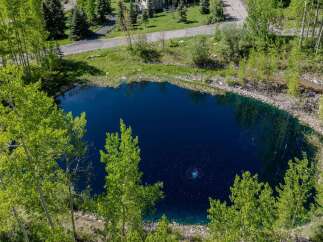 Discover tranquility at this secluded property boasting a stunning private pond.