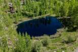 This secluded mountain property boasts a stunning private pond, perfect for enjoying the tranquility of nature.