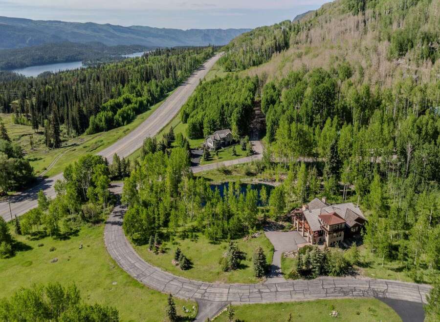 Mountaintop estate with stunning views and private pond.