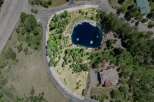 Nestled in a serene mountain setting, this exceptional property boasts a private pond and lush landscaping.