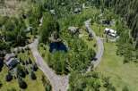 This secluded mountain property boasts stunning views and a private pond.