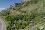 Nestled in a mountainside forest, this stunning property offers breathtaking views and a tranquil atmosphere.