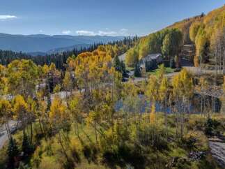 Nestled amidst the vibrant hues of autumn, this stunning property offers a serene escape.