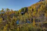 Nestled amidst the vibrant hues of autumn foliage, this stunning property offers a serene escape.