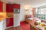 This cozy studio apartment features a fully equipped kitchenette with microwave and refrigerator, perfect for a comfortable stay.