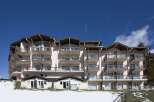 This stunning ski resort hotel boasts multiple floors with private balconies, offering breathtaking views.
