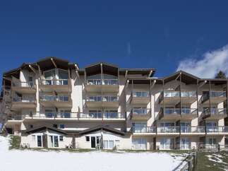 This stunning ski resort hotel boasts multiple floors with private balconies, offering breathtaking views.