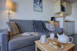 Cozy apartment featuring a comfortable sofa, perfect for relaxing after a day on the slopes.