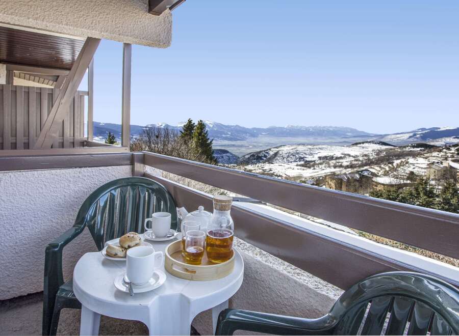 Enjoy breathtaking mountain views from your private balcony, perfect for a relaxing morning tea.