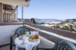 Enjoy breathtaking mountain views from your private balcony, perfect for a relaxing morning tea.