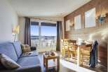 This stunning apartment boasts breathtaking mountain views from its large window and private balcony.