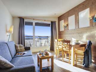 This stunning apartment boasts breathtaking mountain views from its large window and private balcony.