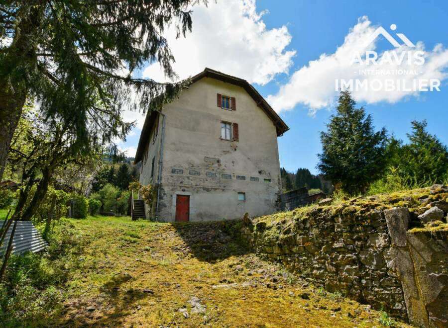 Discover this charming farmhouse nestled in a serene mountain setting.