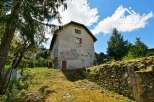 Discover this charming farmhouse nestled in a serene mountain setting.