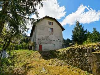 Discover this charming farmhouse nestled in a serene mountain setting.