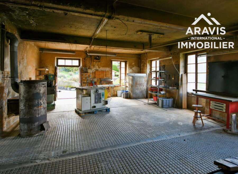 Large workshop with high ceilings and ample natural light.