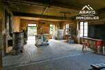 Large workshop with high ceilings and ample natural light.