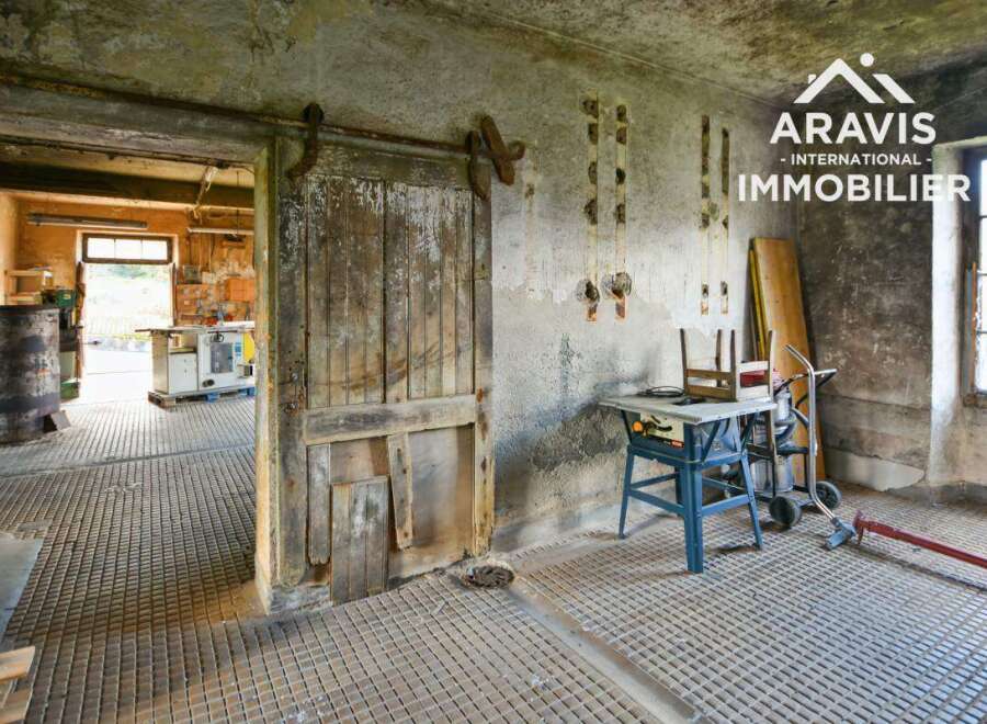 Discover this unique property featuring a spacious workshop with ample storage.