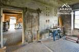 Discover this unique property featuring a spacious workshop with ample storage.