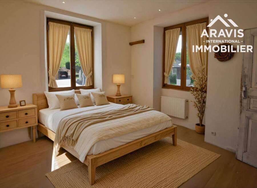 Charming bedroom with wooden floors and a cozy atmosphere.