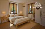 Charming bedroom with wooden floors and a cozy atmosphere.