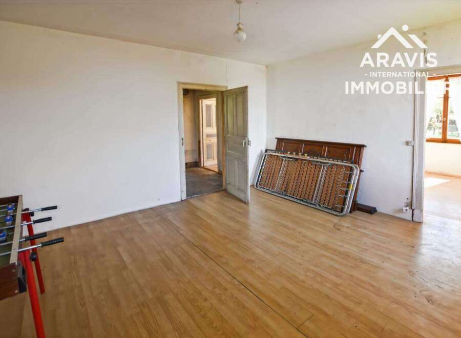 This spacious room boasts beautiful hardwood floors and ample natural light.