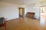 This spacious room boasts beautiful hardwood floors and ample natural light.