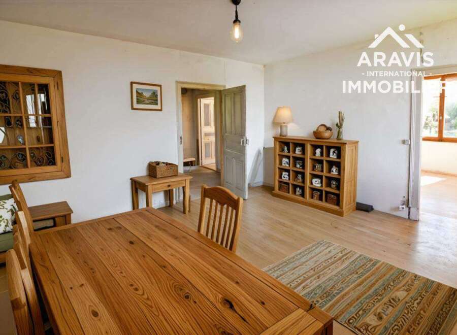 Charming country house with wooden floors and a spacious dining area.