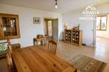 Charming country house with wooden floors and a spacious dining area.