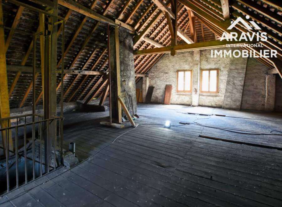 Discover this unique attic space with exposed wooden beams and original flooring.