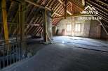 Discover this unique attic space with exposed wooden beams and original flooring.