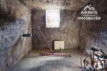 Discover this unique property featuring a spacious cellar, perfect for storage or a workshop.