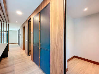 Explore the elegant design of this property, featuring stunning wooden accents and a modern aesthetic.