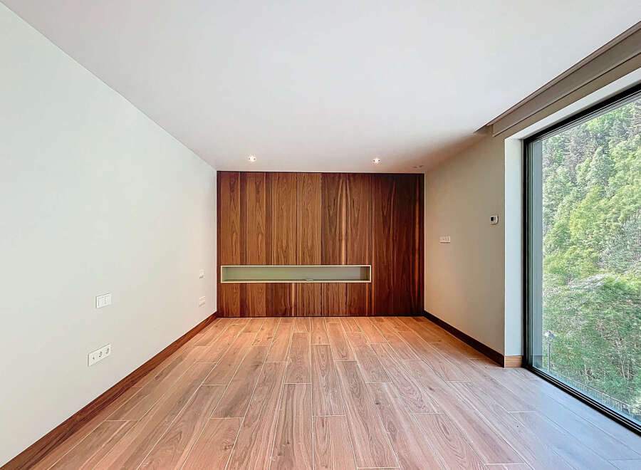 Discover a modern interior with a stunning wooden accent wall.