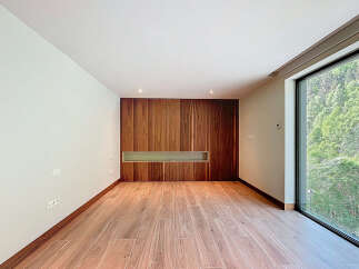 Discover a modern interior with a stunning wooden accent wall.
