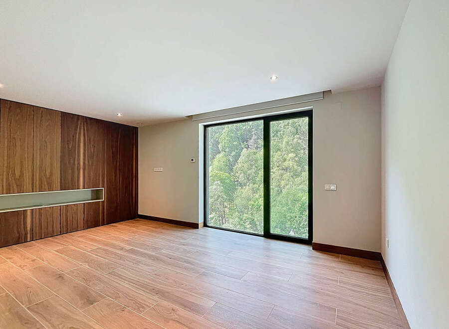 Discover a modern interior with sleek wooden paneling and a bright, airy atmosphere.