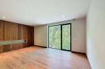 Discover a modern interior with sleek wooden paneling and a bright, airy atmosphere.