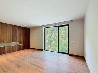 Discover a modern interior with sleek wooden paneling and a bright, airy atmosphere.